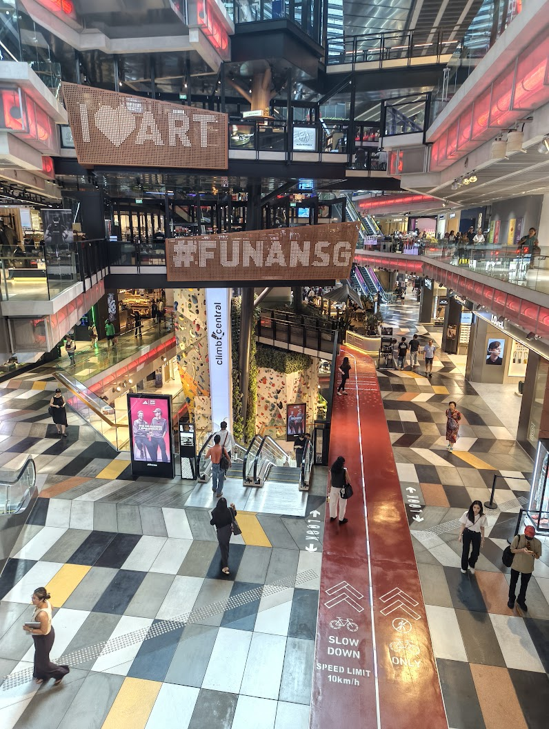 Funan Mall. Features a bouldering gym and a cycling track. Also looks futuristic AF!